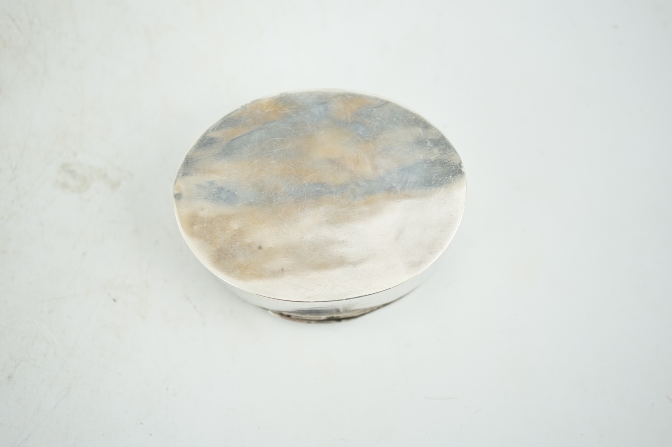 An early 20th century white metal oval snuff box